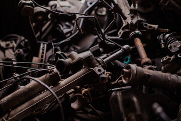 Fototapeta na wymiar Car motor parts. Auto motor mechanic spare or automotive piece on dark background