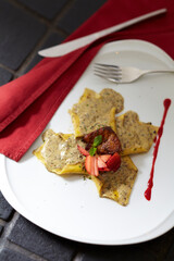 Pasta cream sauce topping with strawberries and grilled meat