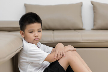 Asian child  sitting alone with sad feeling, Concept for bullying, depression stress or frustration