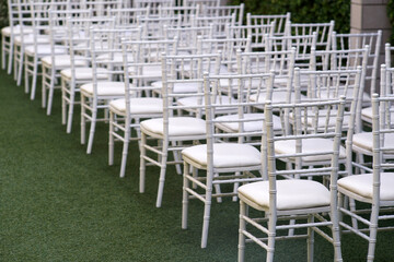 Row of white chairs in party event