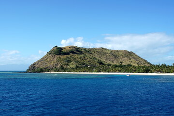 Beach around a rugged island in Fiji