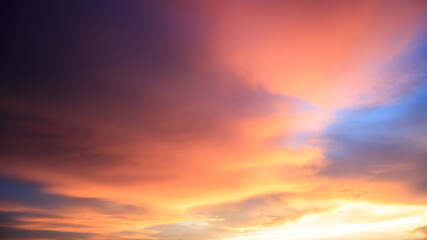 Background of orange sky and clouds with sunset light in evening at summer time when with blank copy space, showing about environment, climate concept.