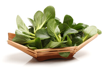 fresh spinach leaves in a wooden bowl