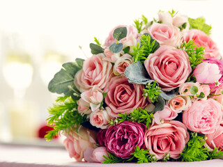 Sweet color rose bouquet with two glasses of wine, love, dating and anniversary concept