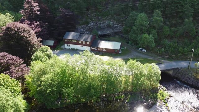 Dalekvam salmon hatchery - Successfull hatchery of wild salmon smolt locasted in western Norway - Aerial view of Hatchery and river coming from powerplant tunnel