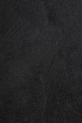 Dunkelgrauer schwarzer Schieferhintergrund oder -beschaffenheit. © peekeedee