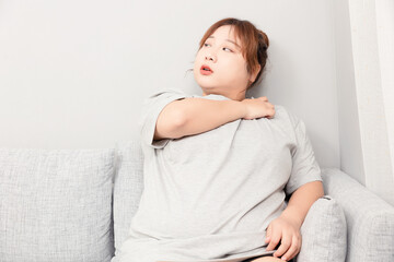 Asian fat girl sitting on the sofa