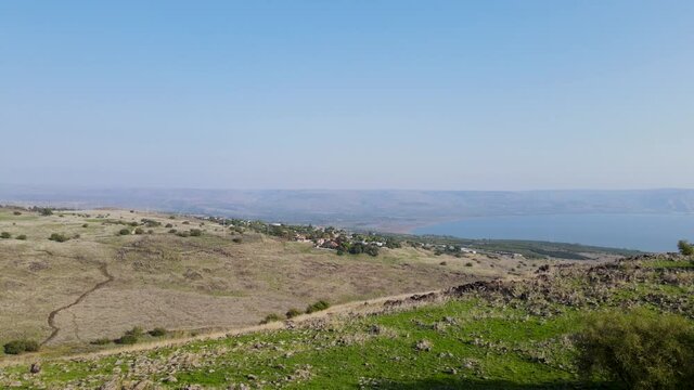 drone flight towards sea of galilee  above valleys and hills