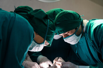 Medical team performing the surgery in the operating room at the hospital