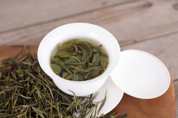 Brewed green tea in a white porcelain tureen