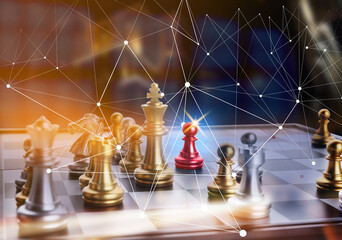 Chess pieces on checkerboard against dark background