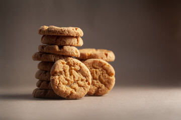 Close-up of stacking delicious freshly microwave oven baked simple cookies or biscuits.