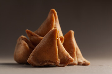 Close-up of freshly baked spicy and sweet samosa filled with dry fruits spicy dry chutney...