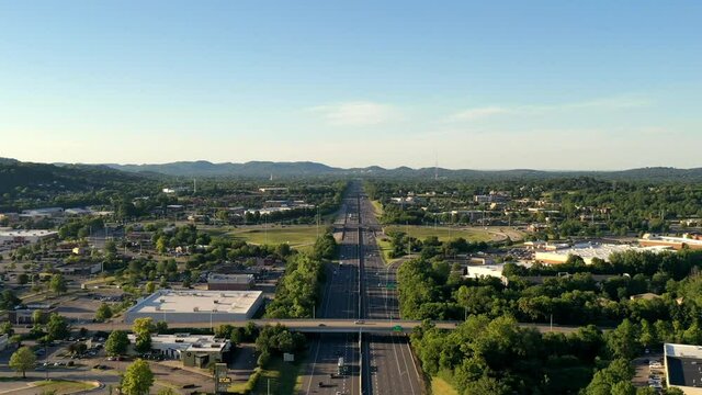 Aerial time lapse over the interstate looking north towards Nashville on summer evening after work.