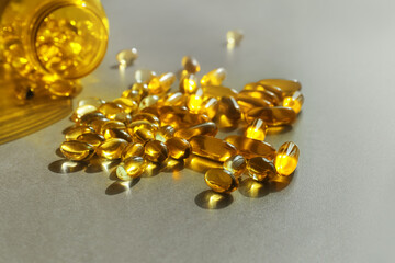 Fish oil capsules on grey background