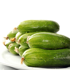 Green cucumber on the white background
