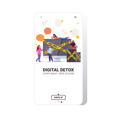 people near gadgets with keep away yellow tape digital detox rest from devices concept
