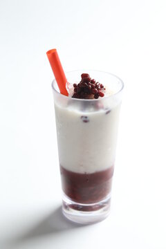 Ice Cold Chilled Fresh Sweet Coconut Milk Soya Drink With Red Bean Paste And Red Straw Beverage Menu In White Background