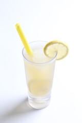 ice cold chilled fresh sour lemon fruit honey drink in glass and yellow straw beverage menu in white background