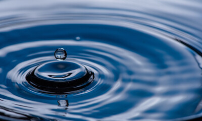 Water drop splash blue colored.