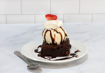 Brownie Ice Cream Sundae topped with a strawberry slice