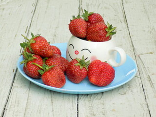 strawberries in a bowl on table