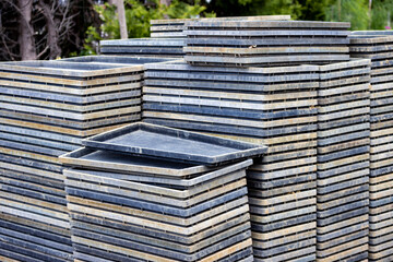 Image of piles of empty seedling boxes.