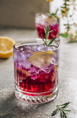 Butterfly pea flower tea with lemon. Purple iced lemonade. Healthy detox herbal drink