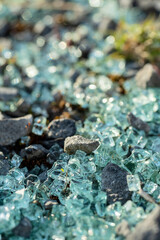 Broken pieces of car glass on the ground. Abstract car accident.Car accident scene.