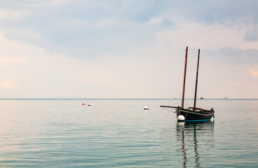 Boat reflecting in calm sea