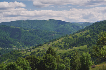 Naklejka na ściany i meble Clouds over the mountains. Sunny day in the mountains. Ukrainian Carpathian mountains. Svidovec ridge.