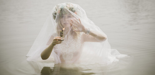 Bride making magic of candles, magical attributes, herbs and flowers, Slavic/ Wicca rituals and...