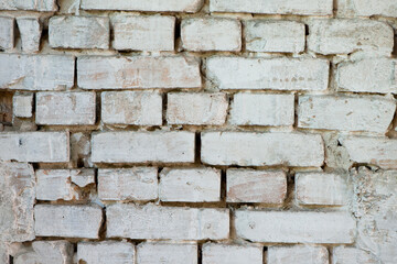 Abstract old white brick wall. background facade brick wall black and white. Vintage old brick wall texture. Grunge stone wall horizontal background. Dilapidated building facade with damaged plaster.
