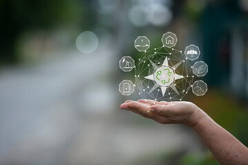 Technology, hand holding with environment Icons over the Network connection on green background.