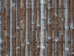 Wooden wall from the logs of a barn