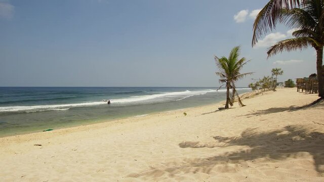 sandy beach on a tropical island with palm trees. Seascape, ocean and beautiful beach. Philippines, Anda, Pangasinan. Travel concept.
