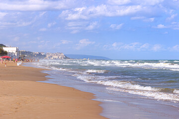 Walking on the beach. Apulia coast: San Menaio Beach in Gargano National Park, Italy. A long golden...