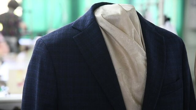 Men's suit on a mannequin at a sewing production