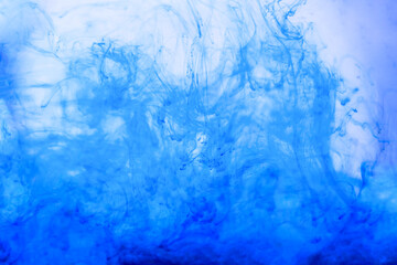 Fototapeta na wymiar Cobalt blue and aquamarine colors mix. Acrylic Painting. Paint movement macro. Glitter ink flow. Glitter fluid motion. Moving flowing stream of liquid paint. Decorative abstract art background