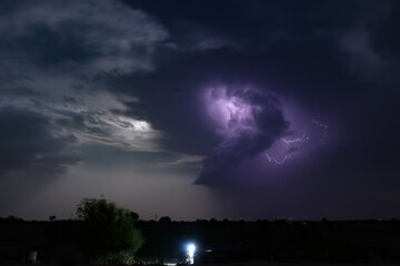 Lightning strikes at night during a severe thunderstorm