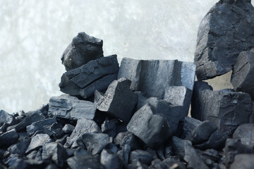 a pile of wood charcoal in the shape of a podium, a photo that is suitable for a product photo...