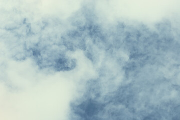 Formation of stormy cloud in fluctuation summer blue sky atmosphere. Dramatic sky painted by color and light on twilight clouds. Soft and blurred aesthetic background.