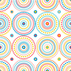 Fototapeta premium Seamless pattern of bright colorful geometric round ethnic decorative elements. Vector background with circles.