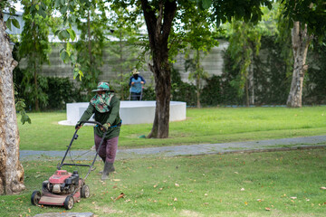 Man mowing across the field in summer.