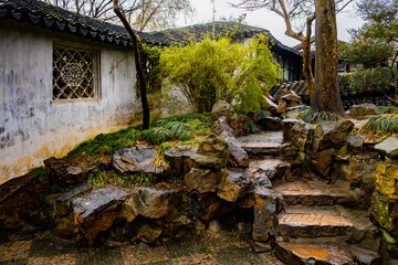 old white walls and stone stairs in the Suzhou park, good place for travel, rest, meditation