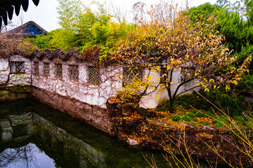 old stone white wall chinese architecture in the Suzhou park good place for travel, rest, meditation