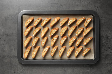 Traditional Italian almond biscuits (Cantucci) on grey table, top view