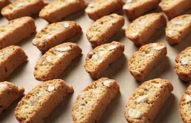 Traditional Italian almond biscuits (Cantucci) on parchment paper, closeup
