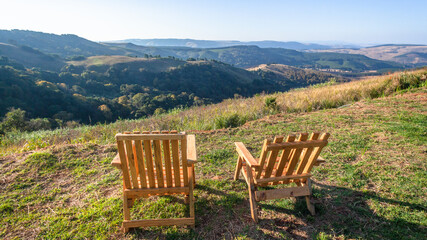 Two Wooden Chairs Mountains Overlooking Valleys Panoramic Holiday Landscape.