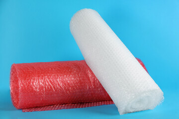 Bubble wrap rolls on light blue background